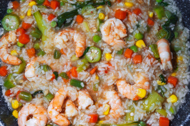 Preparing Cajun Style Chicken, Shrimp and Sausage Jambalaya in a Cast Iron Pot