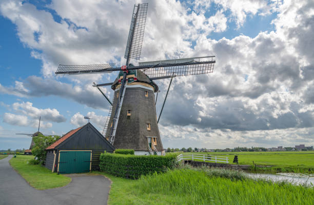 istock Typical Dutch landscape with traditional windmills, Netherlands. 2199752480