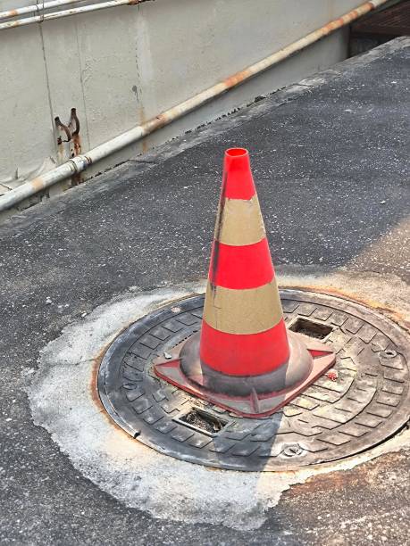 istock Traffic cone on the asphalt road. Road cones, highway cones, safety cones, caution cones. Temporarily redirect traffic 2199757691