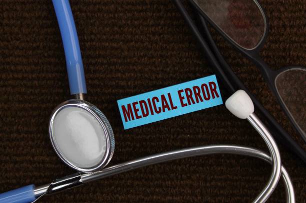 istock Medical Error text with stethoscope. the failure to complete the intended plan of action or implementation of the wrong plan to achieve an intended outcome 2199760004