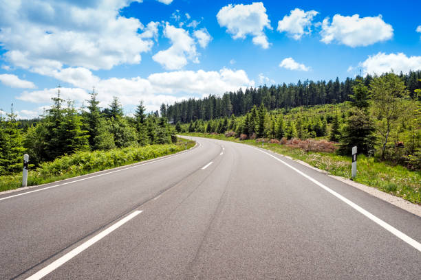 Curved road in green mountain scenery