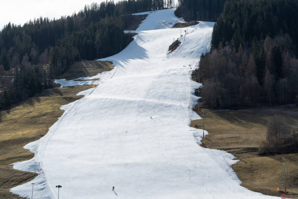 istock lack of snow, artificial ski slope in warm winter 2199763955