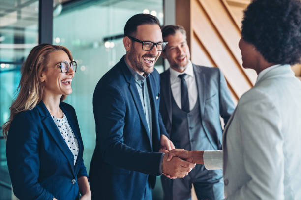 istock Excited young businessman congratulating a colleague 2199765346
