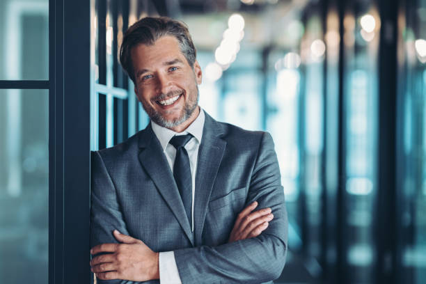 istock Smiling middle aged businessman in formal wear 2199765351