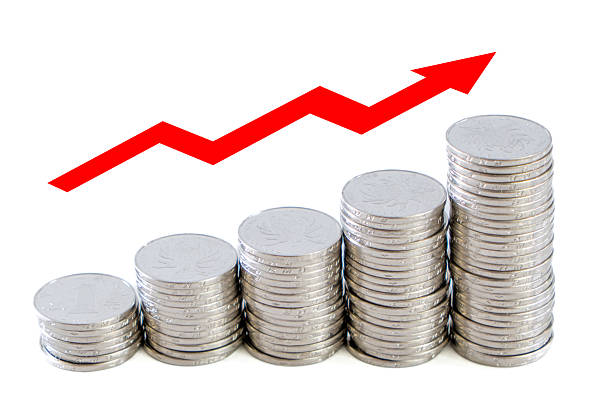 istock Stacked Coins with Arrow Representing Financial Growth and Success 2199769144