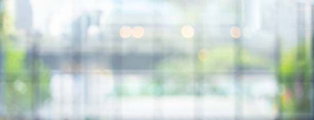 istock Blurred abstract big wall glass with green leaf bokeh.environmental background.not ai generated 2199771382