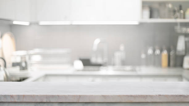istock A marble countertop with blurred of a bright, modern kitchen.The soft focus on the interior background highlights.making it ideal for showcasing kitchen-related products or display design.not ai generated 2199771988