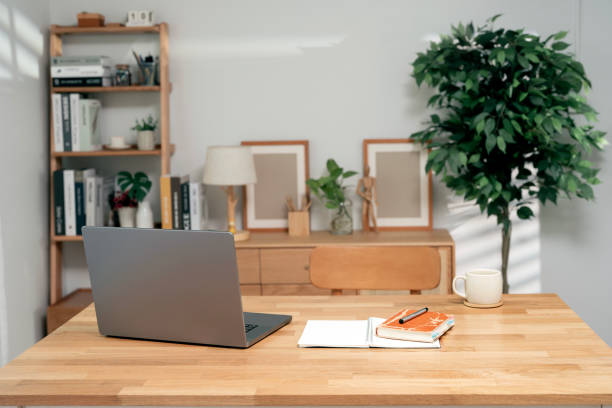 istock Creative home office workspace concept. Rear view of laptop computer on wooden table, copy space, banner background 2199776306