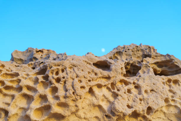 limestone rock formations in the white desert of Egypt to the sunset