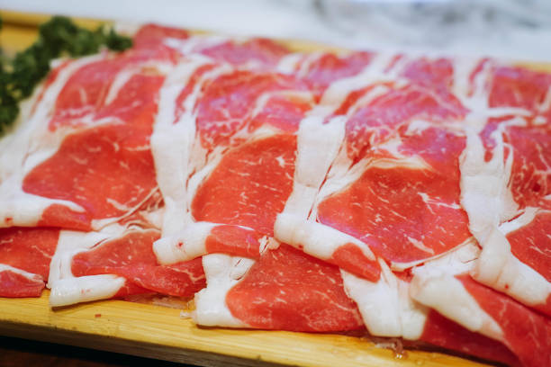 istock A closeup view of a tray of raw thinly sliced beef 2199780455