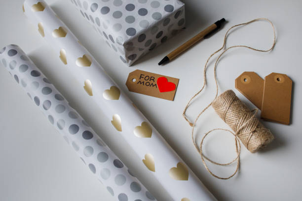 istock Tools for wrapping a present in gift paper for mom top view 2199780503