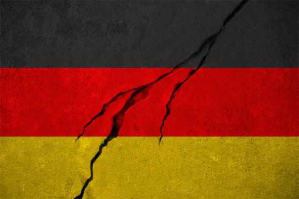 istock German flag on wall with crack. Grunge national flag of Germany. 2199782790