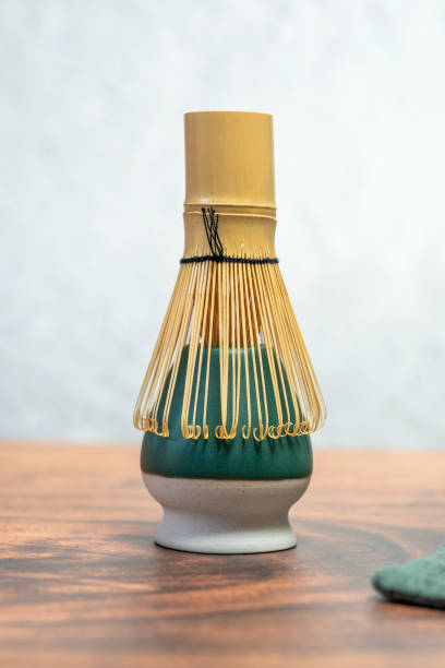 istock Bamboo whisk or chasen resting on a ceramic matcha bowl holder 2199783431