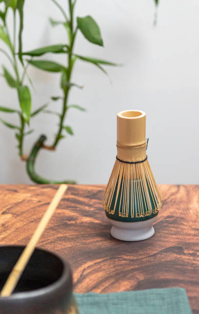 istock Bamboo whisk for matcha tea preparation on wooden table 2199783491