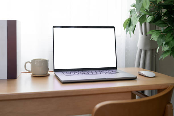istock Laptop with blank white screen on wooden desk, home office, work from home. 2199783724