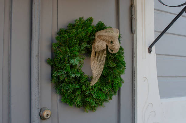 istock A green Christmas wreath on a door. 2199784980