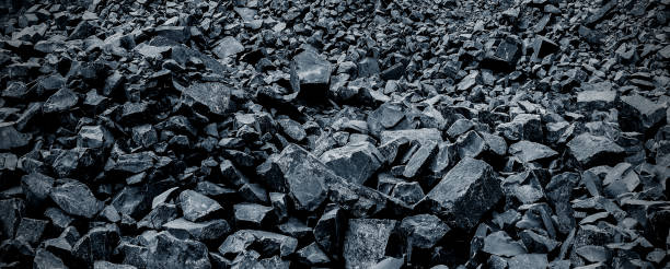 istock Black volcanic stone. Surface of basalt or granite close-up. Dark rough and textured rock. 2199785152
