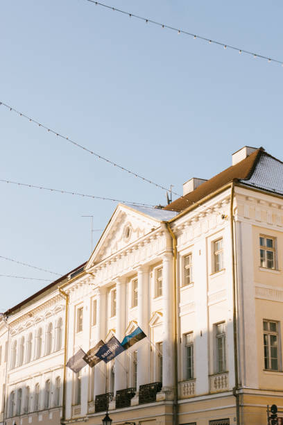 istock A stunning neoclassical building bathed in golden sunlight, showcasing its elegant columns and intricate details against a clear blue sky in a charming European city. 2199785900