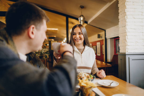 istock Happy young couple visiting local coffee shop 2199792238
