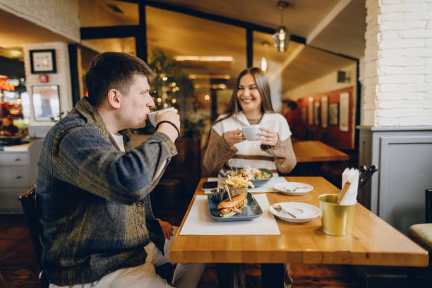 istock Happy young couple visiting local coffee shop 2199792242