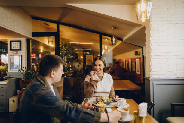 istock Happy young couple visiting local coffee shop 2199792362