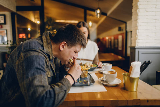 istock Happy young couple visiting local coffee shop 2199792424