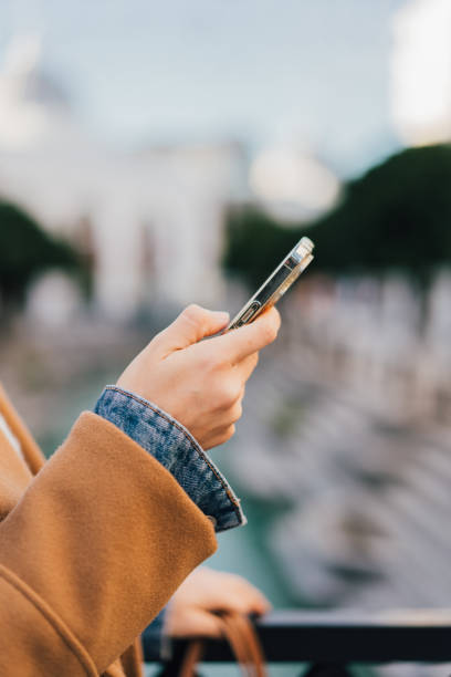 istock Woman using mobile phone app at shopping mall 2199792969