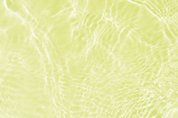 istock Blue water with ripples on the surface. Defocus blurred transparent blue colored clear calm water surface texture with splashes and bubbles. Water waves with shining pattern texture background. 2199794980