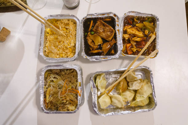 istock Overhead View of Various Asian Takeout Dishes Arranged Symmetrically 2199795055