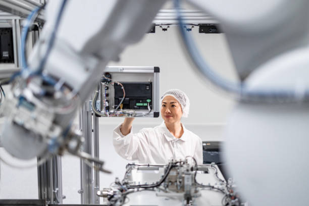 istock Operating robotic arm machines in technology production factory. 2199797749