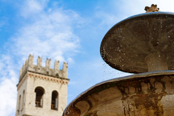 Assisi, Italy: People’s Tower and Fountain in Piazza del Commune