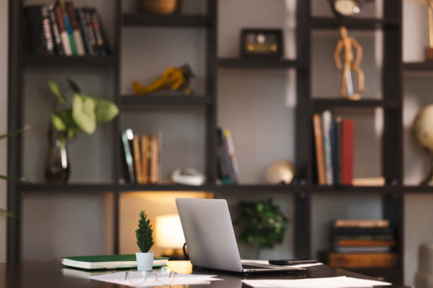 istock Laptop, notebook, and small plants on a desk in a cozy home office, ideal for remote work or studying 2199800441