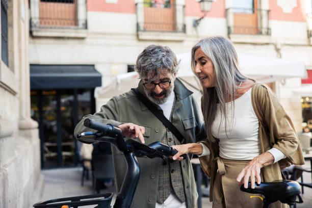 istock Mature couple on vacation renting an e-bike 2199802460