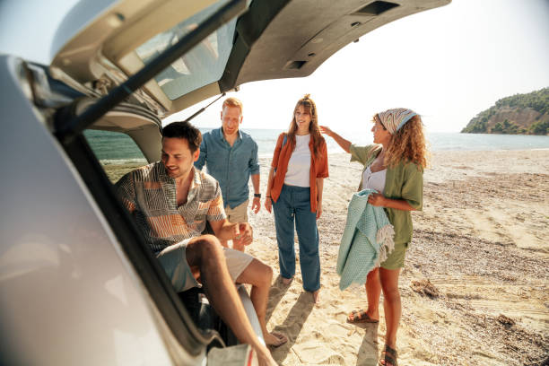 istock Friends having fun at the beach together 2199803675