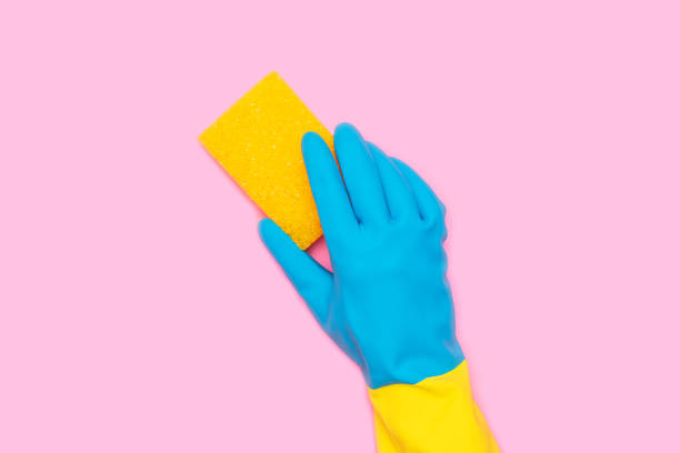 istock Cleaning services, hand with a yellow sponge 2199803750