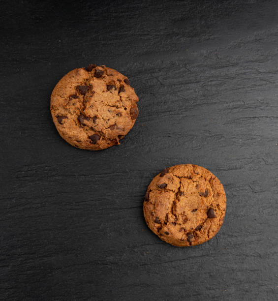 istock Chocolate chips pile cookies , American biscuits, cocoa confectionery cake, sweet morsels bakery 2199807364