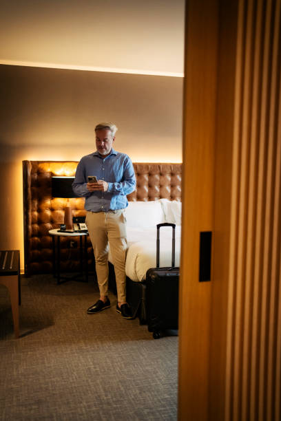 istock Businessman in hotel room 2199807527