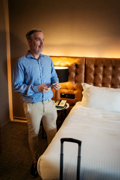 istock Businessman in hotel room 2199807538