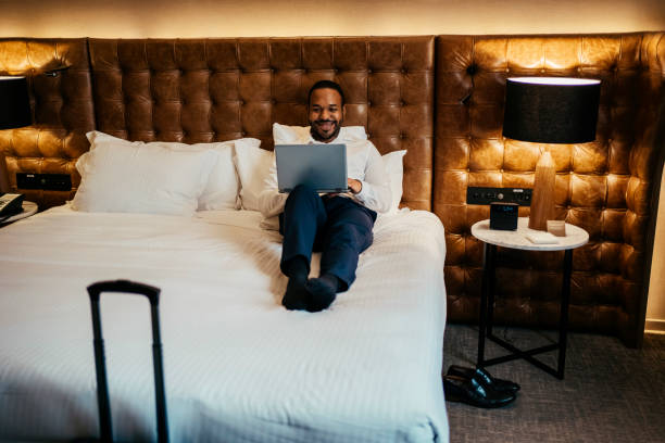 istock Businessman working in hotel room 2199807579