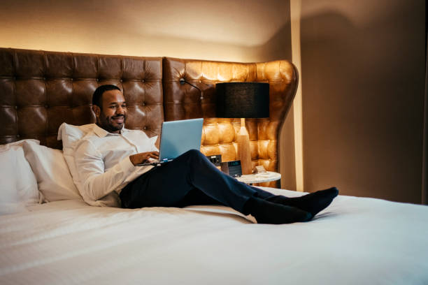 istock Businessman working in hotel room 2199807580