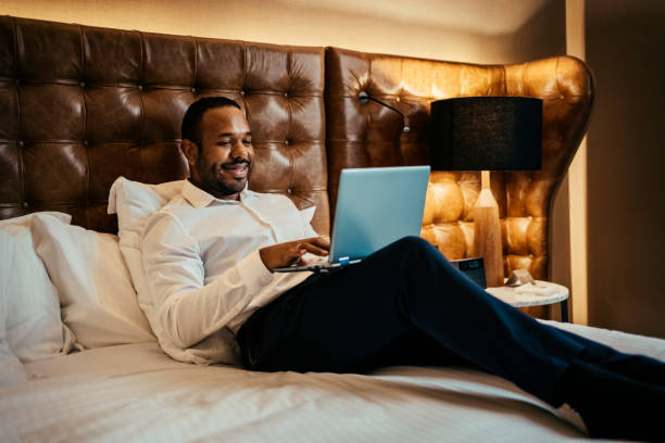 istock Businessman working in hotel room 2199807593