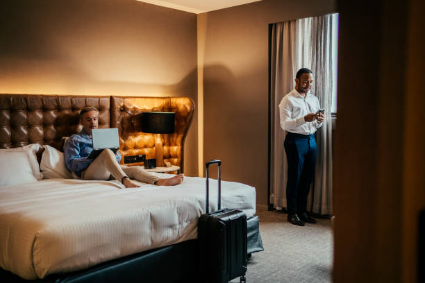 istock Gay couple in hotel room 2199807667