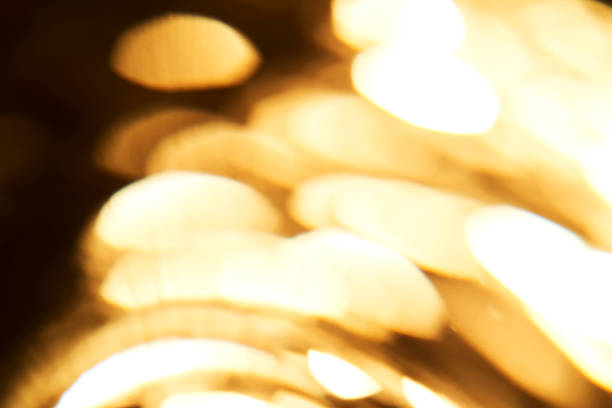 Abstract festive gold background made of sequins. High quality photo.