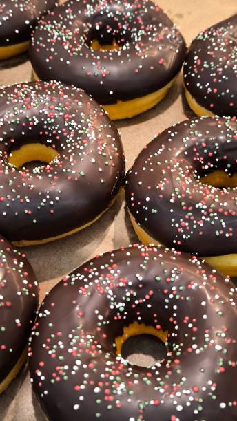 istock Donuts are fried or baked pastries that have a texture similar to cake. 2199814845