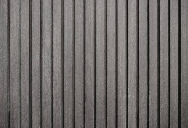 istock Empty dark gray wood wall with groove, abstract wall texture background.Grey wall with patterns, space for work, banner, wallpaper, copy space, decoration and design. 2199814952