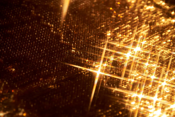 Abstract festive gold background made of sequins. High quality photo.