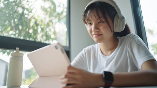 istock Teenage girl using digital tablet. 2199816863