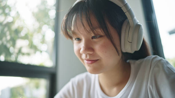 istock Teenage girl using digital tablet. 2199816867