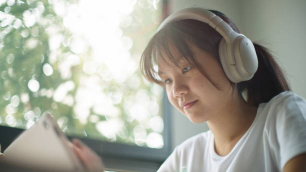 istock Teenage girl using digital tablet. 2199816881