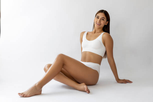 istock Beautiful female sitting in a white lingerie 2199818645